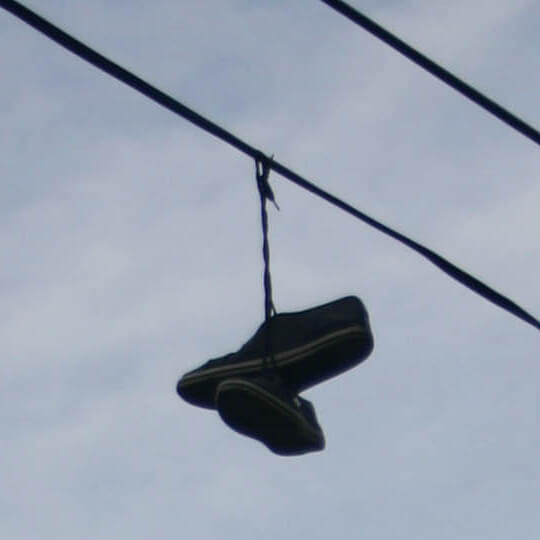 A victims' shoes thrown over cables to prevent retrieval